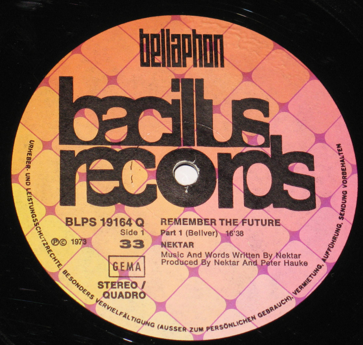 Close-up of the Side One label of Nektar's 'Remember the Future' vinyl record, released by Bacillus Records under Bellaphon. The label features a retro geometric pink and orange pattern, bold black typography, and track details for Part 1 of the album, including its duration of 16:38.