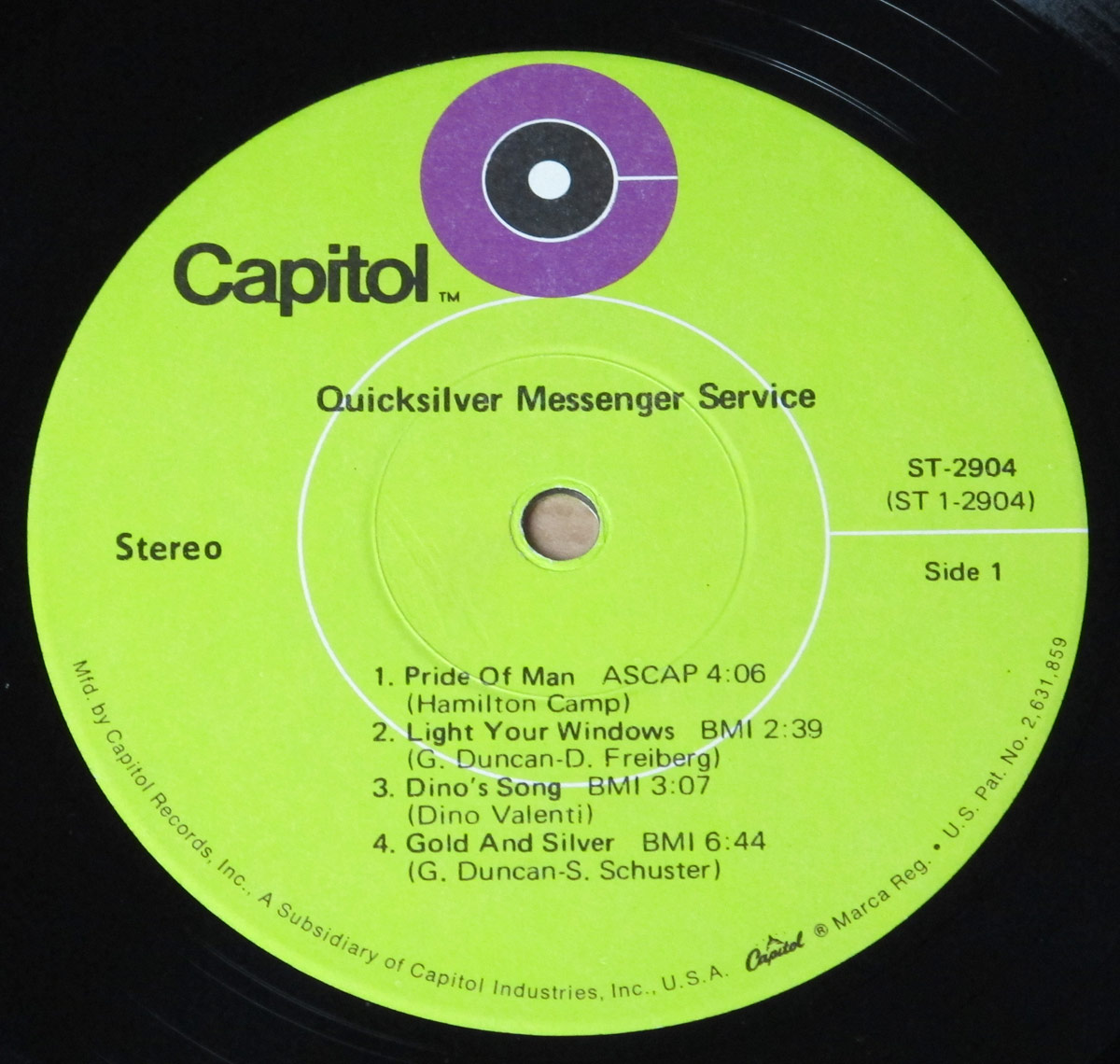 Lime green Capitol Records label for Quicksilver Messenger Service's debut album (ST-2904), featuring the Capitol logo, tracklist for Side 1, and manufacturing details.