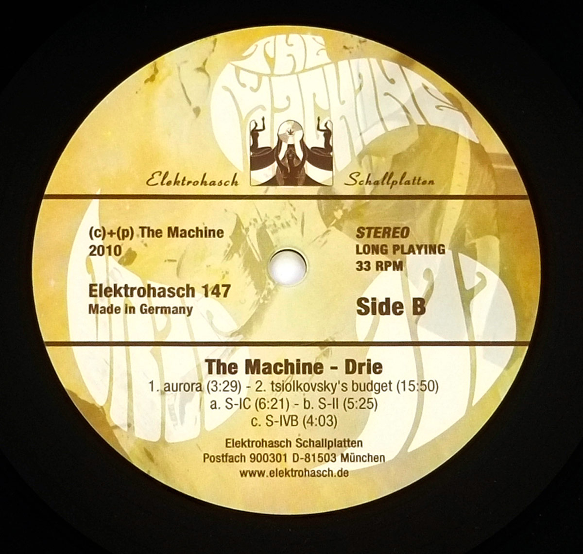 Side Two Close up of record's label THE MACHINE - Drie