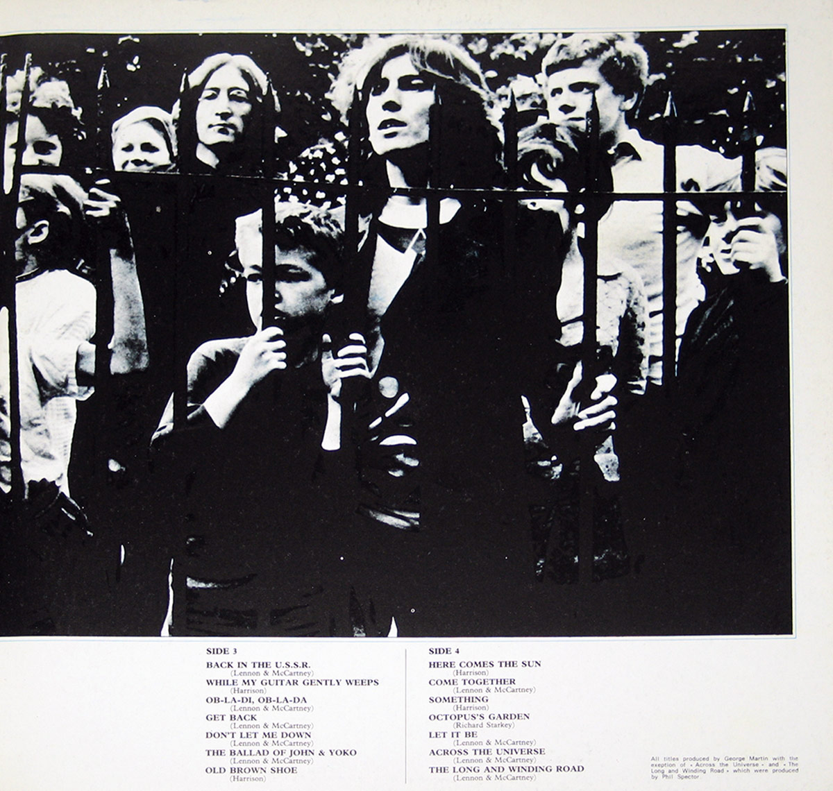 The inner right cover of The Beatles' '1967-1970' (Blue Album) Italian release features a black-and-white photograph of people standing behind an iron fence. A young boy in the foreground clutches the bars, while a woman with long hair gazes outward with an intense expression. Behind them, various individuals, including children and adults, display emotions ranging from contemplation to curiosity. The tracklist for Sides 3 and 4 is printed below in a structured layout.