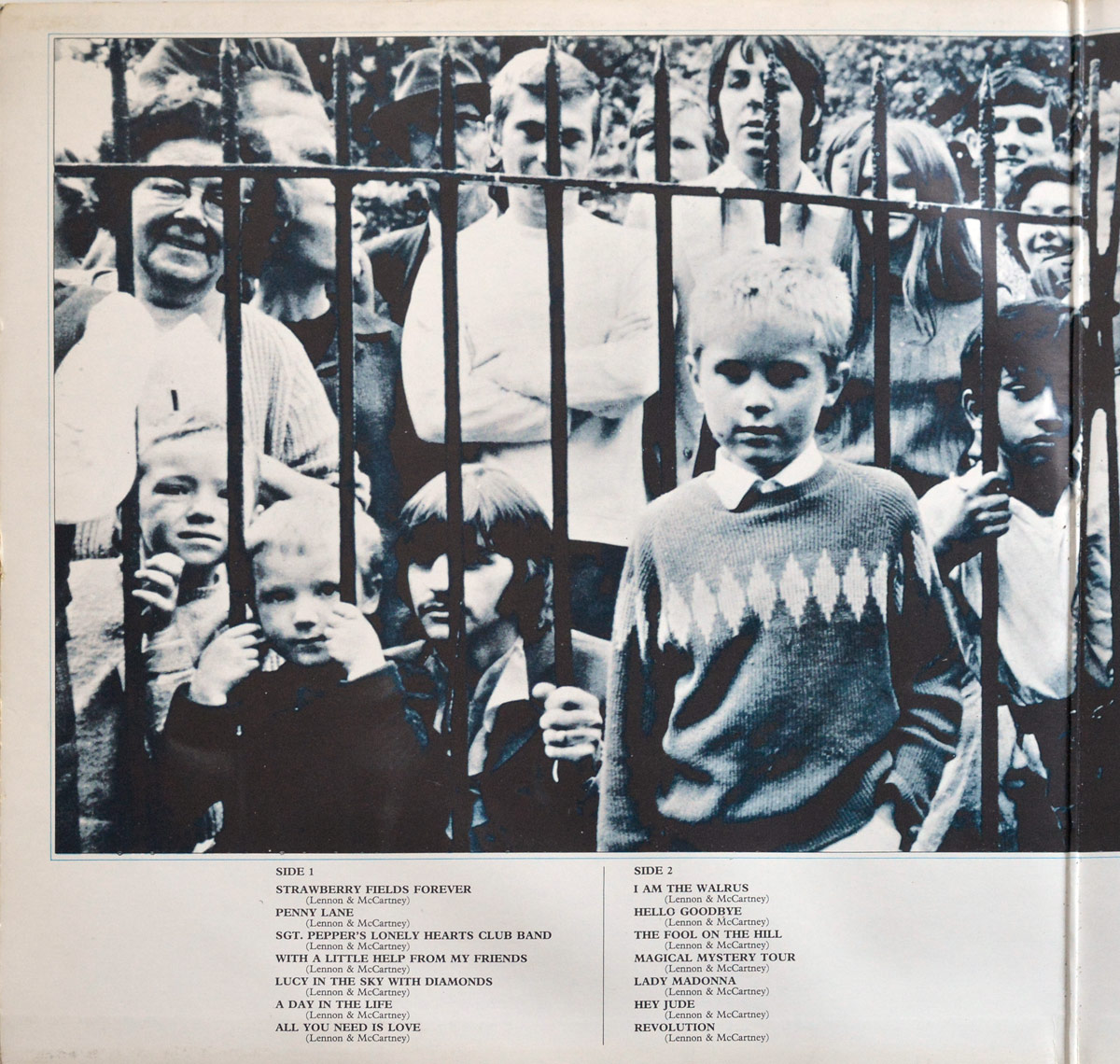 Inside gatefold cover of The Beatles 1967-1970 Blue Album, featuring a monochrome photograph of fans behind iron bars, including children and adults, with Ringo Starr partially visible behind the fence. Track listing for Sides 1 and 2 is printed below.