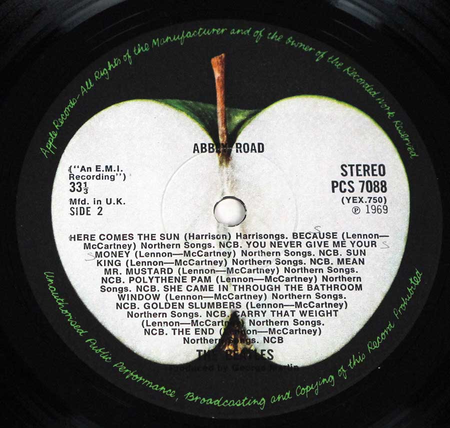 Close-up Photo of "BEATLES - Abbey Road Original UK misaligned Apple PC 7088" Record Label 
