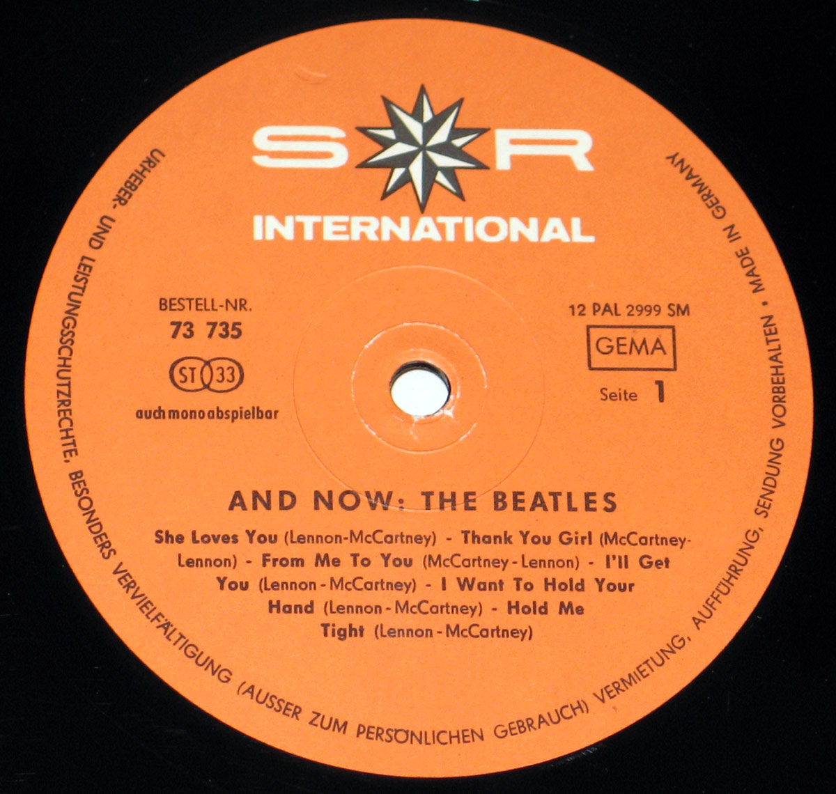 Orange record label for And Now: The Beatles featuring the S*R International logo with a star emblem at the top, German legal text around the edges, catalog number 73 735, and side designation Seite 1.