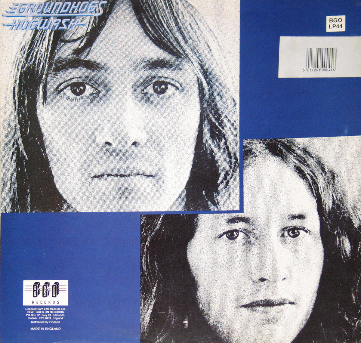 Back cover of the Groundhogs' 1972 album 'Hogwash,' featuring high-contrast, halftone portraits of two band members, arranged in an abstract, layered collage against a deep blue background. The album title and band name appear in bold, futuristic blue font in the upper left corner.