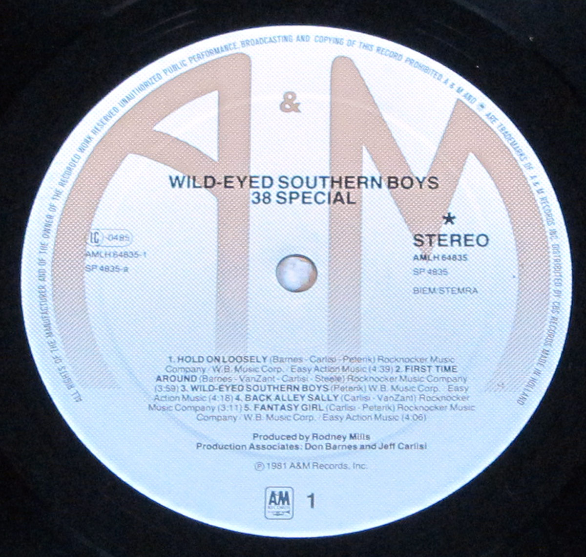 Side One label of 38 SPECIAL's Wild-Eyed Southern Boys LP showing track titles, credits, and catalog details printed on a white label with a large brown A&M logo in the background.