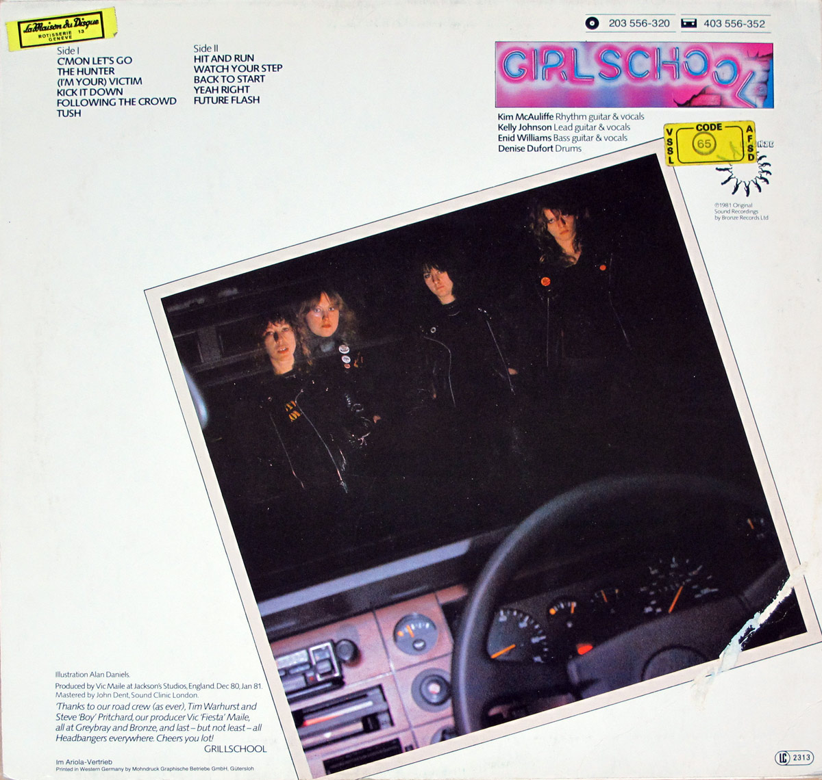 Back cover of Girlschool - Hit and Run showing a mostly white sleeve with track lists at upper left, catalog numbers 203 556-320 and 403 556-352 at upper right, and a neon GIRLSCHOOL logo strip. A tilted dark photo dominates the centre, showing the four band members in black leather seen from inside a car, with dashboard and steering wheel in the foreground. Credits and GRILLSCHOOL typo appear at lower left.