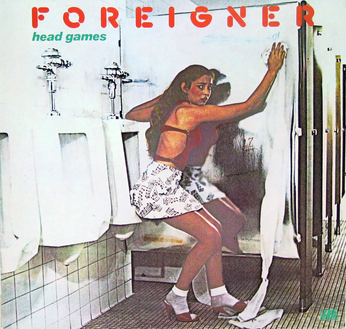 Foreigner’s Head Games album cover featuring a young woman in a red top and white skirt with musical note patterns, leaning against a graffiti-covered wall in a men’s restroom. She appears surprised or caught off guard, glancing over her shoulder with urinals visible beside her. The scene captures a rebellious and edgy tone, reflecting the album’s themes.