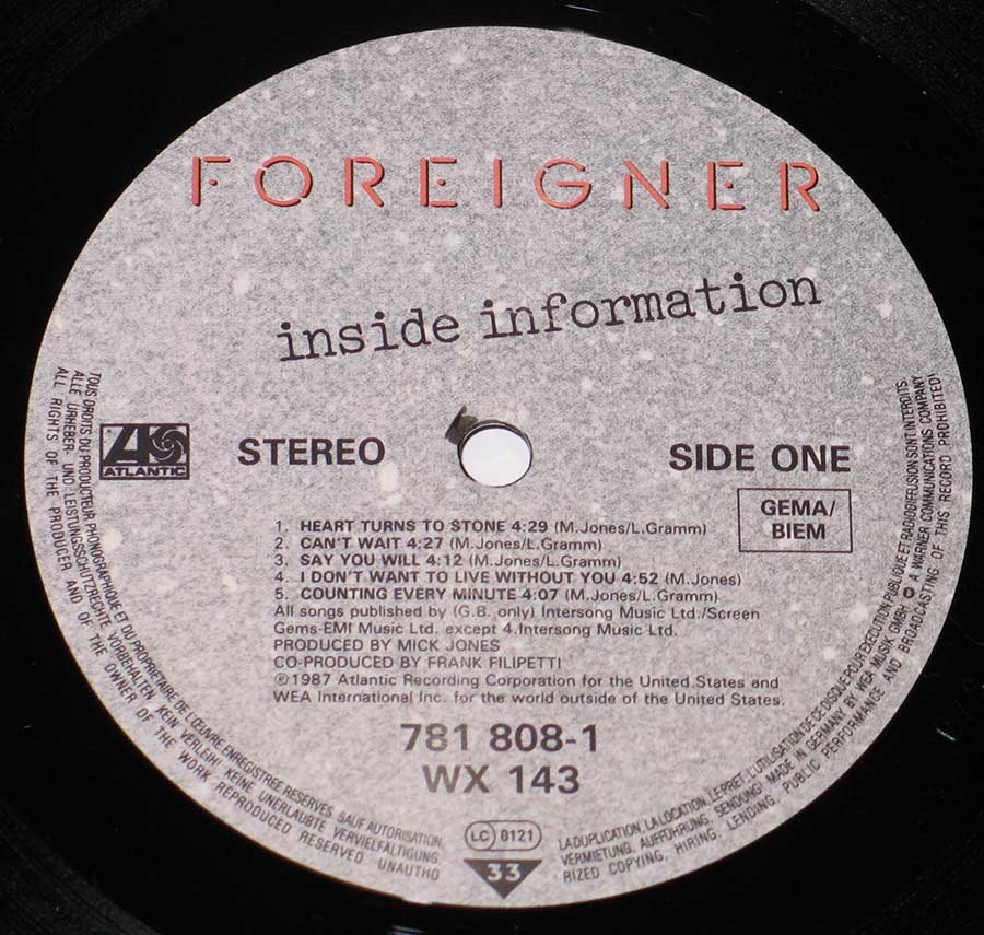 Close up of record's label FOREIGNER - Inside Information 12" Vinyl LP Album Side One