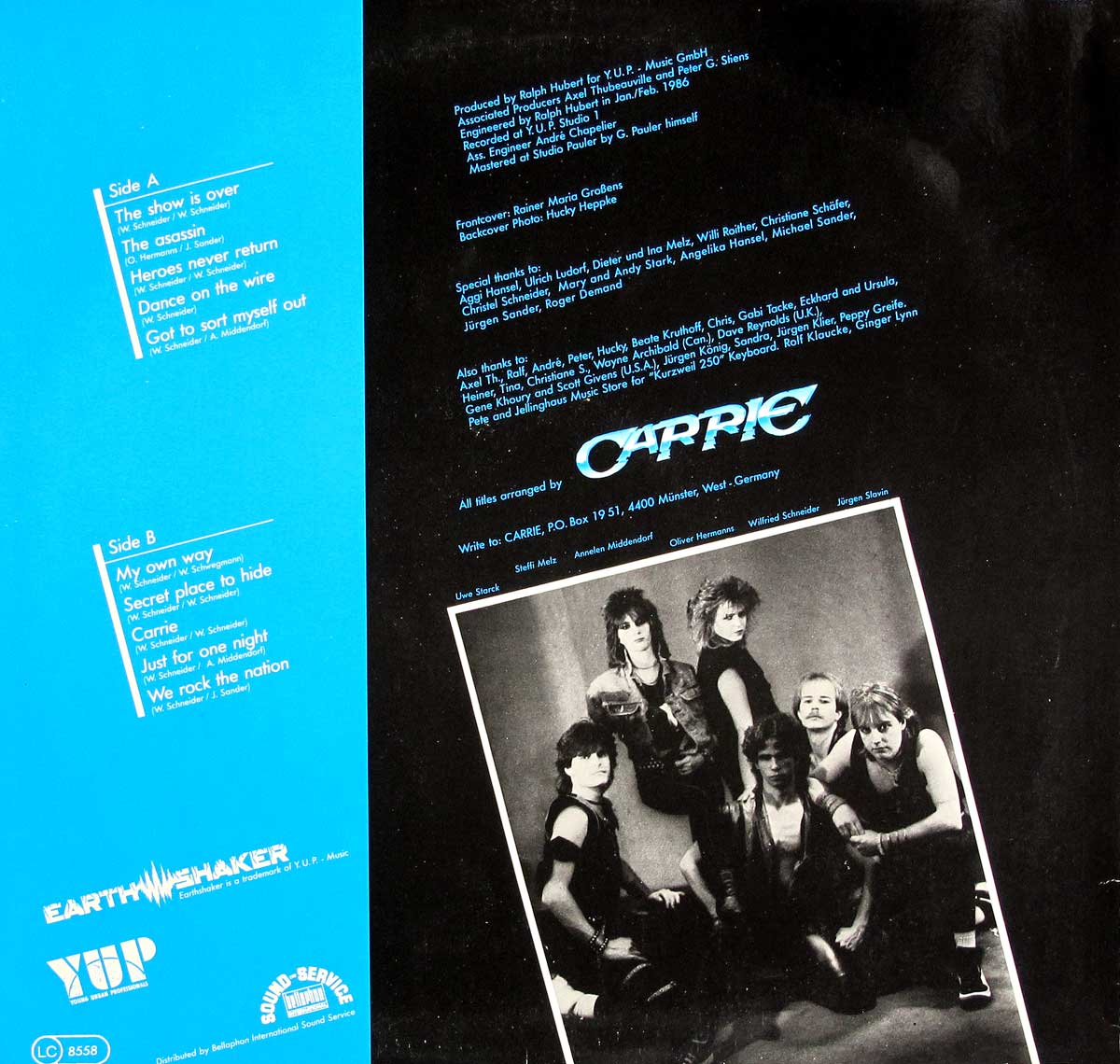 Back cover of Carrie’s Secrets album featuring a two-panel design with a blue section listing Side A and Side B tracks, and a black section with production credits, acknowledgments, and a black-and-white photo of the band members dressed in 1980s rock attire.