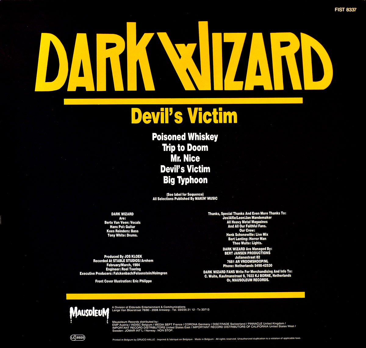 Back cover of Dark Wizard's 1984 EP Devil's Victim, Mausoleum Records Belgium release. The artwork is minimalistic with a stark black background and bold yellow typography. At the top, the band name Dark Wizard appears in large capital letters, followed by the EP title Devil's Victim in yellow. Below, the tracklist is presented in white text, featuring Poisoned Whiskey, Trip to Doom, Mr. Nice, Devil's Victim, and Big Typhoon. The bottom section contains detailed credits: musicians, producer Jos Kloek, engineer Roel Toering, executive producers Alfie Falkenbach, Leo Felsenstein, and Stonne Holmgren, and cover illustrator Eric Philippe. Additional acknowledgments, thanks, and Mausoleum Records distribution details are also printed.
