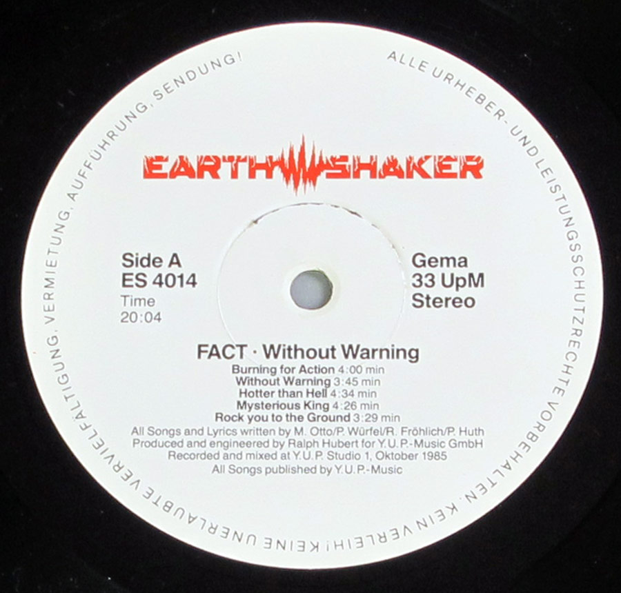 Record label for Side A of the album 'Without Warning' by Fact, released on Earthshaker Records. Features a white background with the red Earthshaker logo at the top, black text detailing the album and band name, side designation, catalog number ES 4014, playback speed (33 UpM Stereo), and copyright information around the edge.