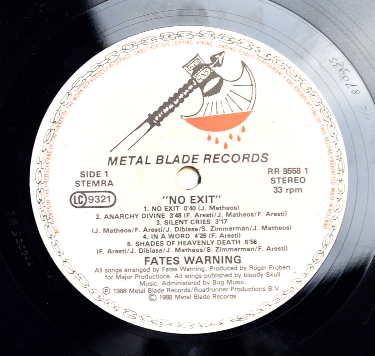 Close-up of Side One of the Fates Warning 'No Exit' vinyl LP, featuring the iconic Metal Blade Records label with the 'Blood Dripping Axe' logo at the top. The tracklist for Side One includes 'No Exit,' 'Anarchy Divine,' 'Silent Cries,' 'In a Word,' and 'Shades of Heavenly Death.' The label also features copyright details, publishing information, and credits for Major Productions.