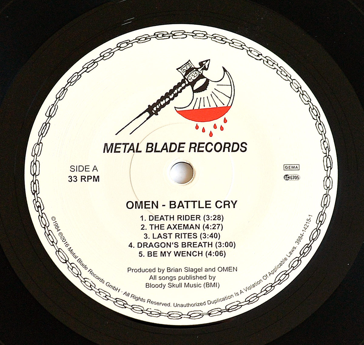 OMEN - Battle Cry Side One record label: Features Metal Blade Records’ iconic blood-dripping axe logo, tracklist including 'Death Rider' and 'The Axeman,' and production credits. Visit https://vinyl-records.nl