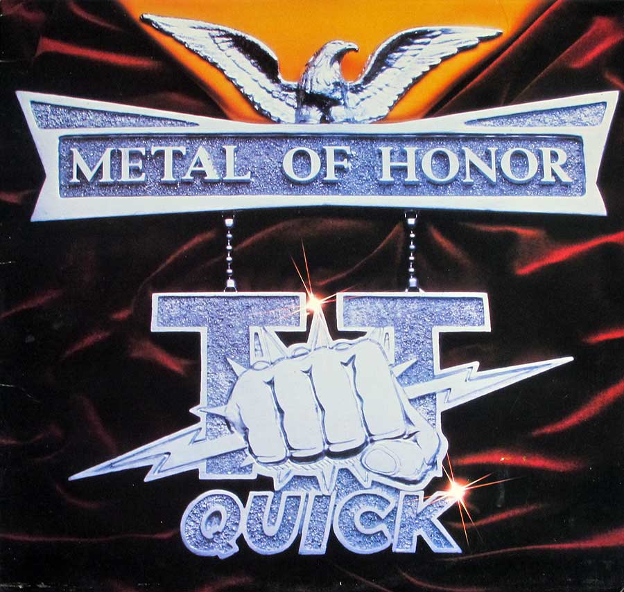 Album cover of TT Quick’s Metal of Honor featuring a silver eagle perched above a metallic banner with the text ‘Metal of Honor,’ a chrome fist emerging from the Roman numeral ‘II’ with lightning bolts, and the band’s name ‘Quick’ in bold metallic font, set against a red satin background with an orange glow. https://vinyl-records.nl
