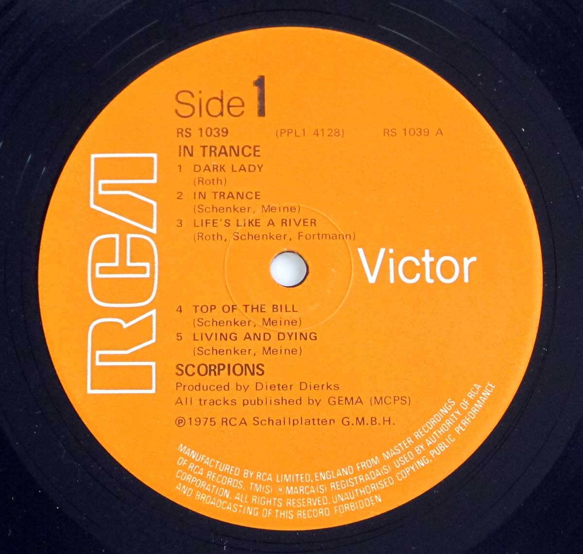 The label has a bold orange background with text printed in black and white. The RCA logo appears prominently on the left in a large, outlined font. Just above the spindle hole, the album's title In Trance and the side number are listed in simple text, along with the catalog number RS 1039.