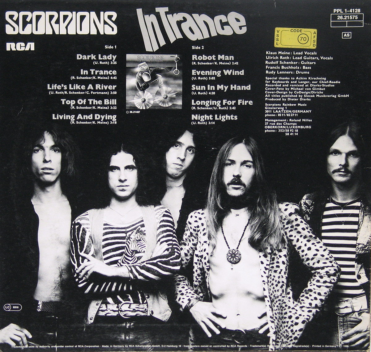 Back cover of Scorpions’ In Trance album featuring a black-and-white group photo of the band members standing side by side with serious expressions. The album title and band name are displayed prominently at the top, along with the RCA logo. Band credits, production notes, and copyright details are listed on the right side, with a yellow label containing catalog information. The design complements the album’s hard rock aesthetic.