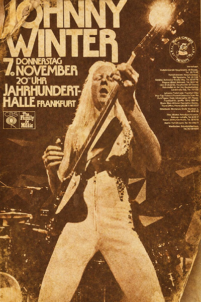 Sepia concert poster: JOHNNY WINTER, Donnerstag 7. November, 20 Uhr, Jahrhunderthalle Frankfurt, photo of a person playing guitar on stage.