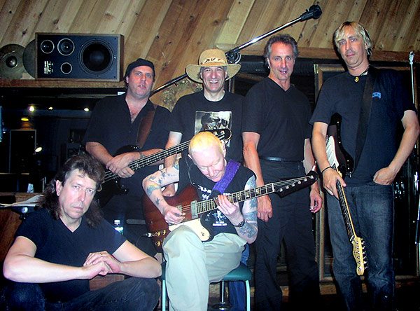 Photo of Johnny Winter and band at the Carriage House, from left to right- Wayne June (drums), Scott Spray (bass), Johnny Winter (guitar), Dick Sherman (producer), James Montgomery (harp) and Paul Nelson (guitar) 