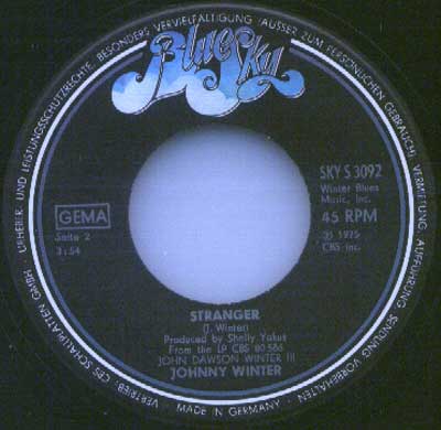 Blue Sky record label for Johnny Winter’s single Stranger, catalogue number SKY S 3092, made in Germany with production credits to Shelly Yakus, released in 1975 under John Dawson Winter III album.