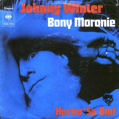 JOHNNY WINTER - Bony Moronie / Hurtin' So Bad Cover art for Johnny Winter's single 'Bony Moronie' with 'Hurtin' So Bad' as the B-side, released by CBS Records. The cover shows a blue-tinted, stylized image of Johnny Winter's face in shadow, angled with an intense expression. Red and white bold text displays his name and the song title. The CBS logo and record number CBS 2391 appear in the top left corner.