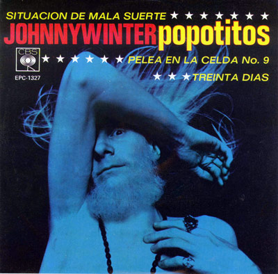 Album cover for Johnny Winter's EP with songs 'Popotitos,' 'Situacion de Mala Suerte,' 'Pelea en la Celda No. 9,' and 'Treinta Dias,' featuring a blue-toned photo of Winter with his arm raised, colorful text, and decorative stars