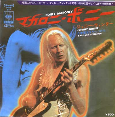 Japanese cover art for Johnny Winter's single 'Boney Maroney' with 'Bad Luck Situation' as the B-side, released by CBS/Sony Records. The cover features Johnny Winter playing guitar, with a red-orange glow around him, set against a blue background with a faded image of him in another pose. Japanese text in red displays the title, with additional text in English and Japanese for his name and song titles. The CBS/Sony logo and record number SOPB 277 appear on the left, with a ¥500 price tag in the bottom right