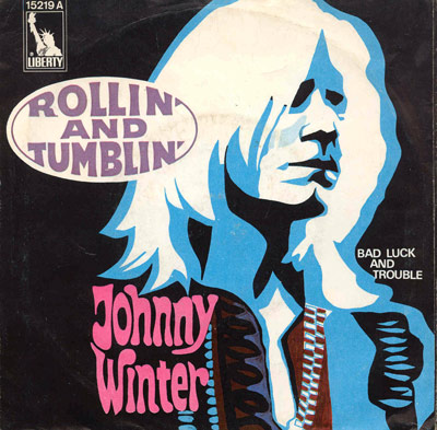 ingle cover for Johnny Winter's 'Rollin' and Tumblin'' and 'Bad Luck and Trouble' featuring a pop-art style portrait of Winter in blue and pink tones, with text and Liberty Records logo