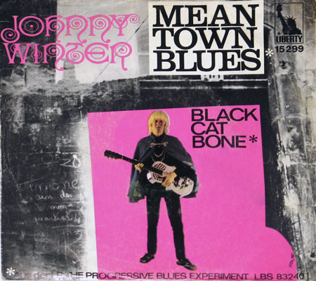 Single cover for Johnny Winter's 'Mean Town Blues' and 'Black Cat Bone' featuring a gritty background with Winter standing with his guitar on a pink square, alongside text and Liberty Records logo