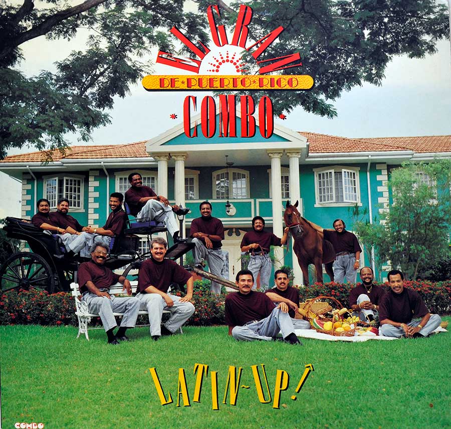 Album cover of Latin Up! by El Gran Combo de Puerto Rico, showing the band members in matching maroon shirts and gray pants gathered outside a colonial-style mansion. Some are seated on a horse-drawn carriage, others around a picnic with fruits, and one stands with a brown horse. The title Latin Up! is displayed in bold yellow text at the bottom