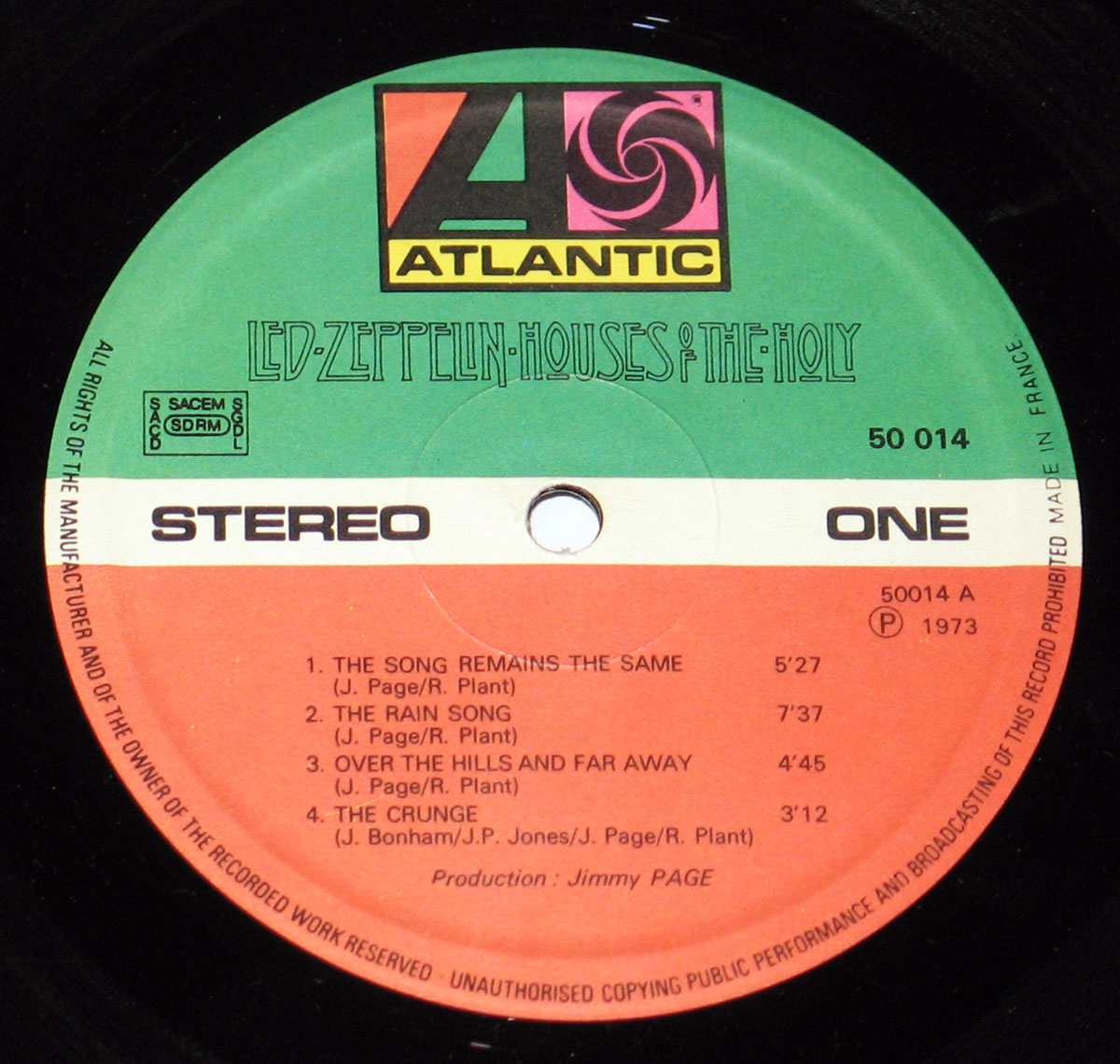 Close-up of Side One label from Led Zeppelin's Houses of the Holy French 1973 pressing. It features the Atlantic Records logo with red, green and white color bands, tracklist, catalog number 50014 A, and production credit to Jimmy Page.