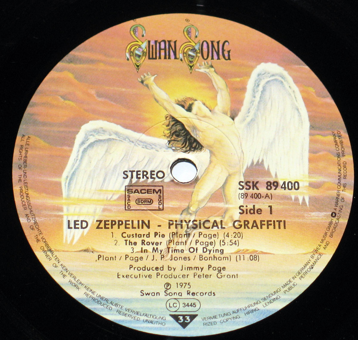 Close-up of Side One record label of Led Zeppelin's Physical Graffiti French pressing on Swan Song Records with angelic artwork and track listing