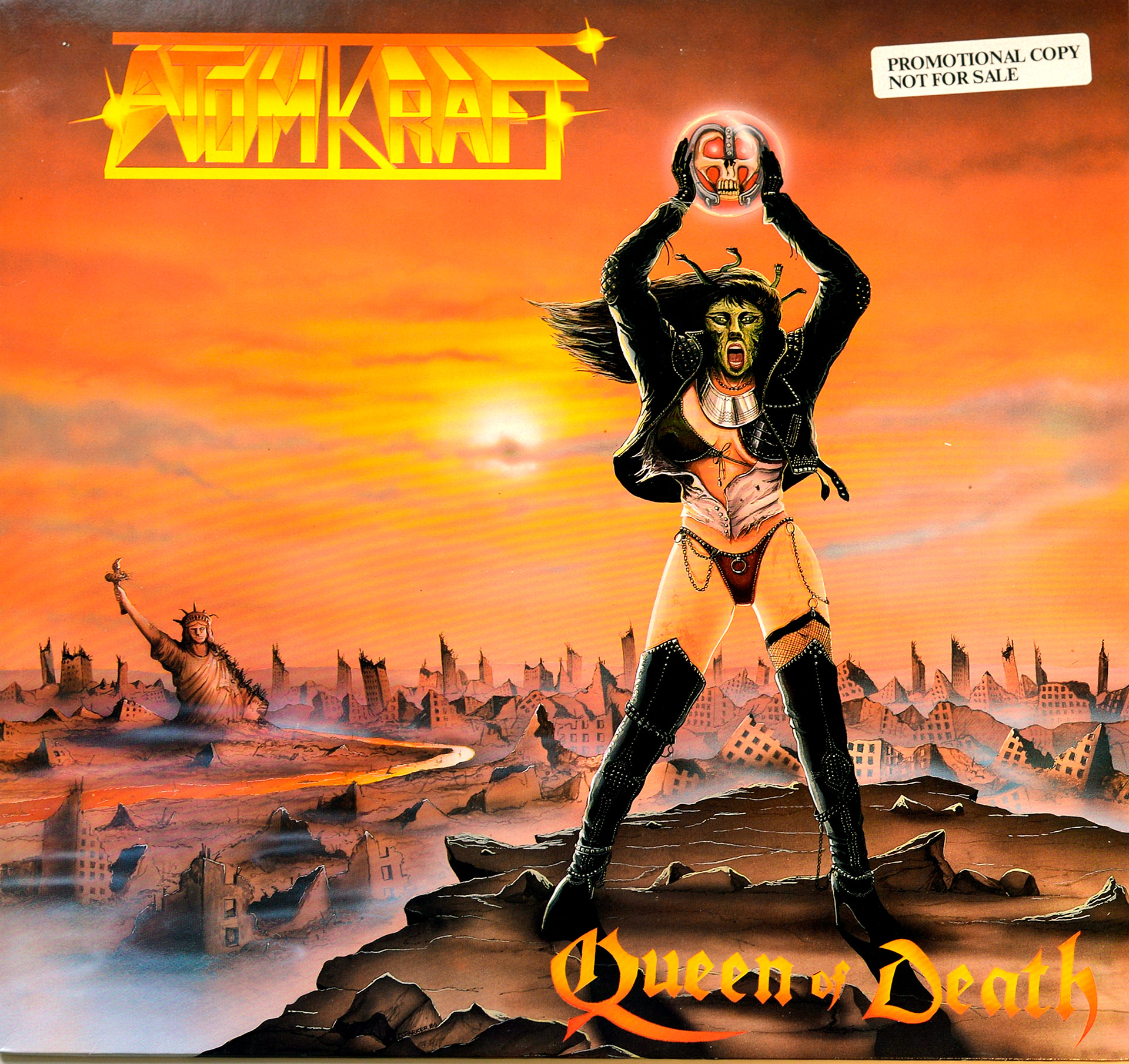 Front cover of Atomkraft’s Queen of Death 12” vinyl LP album. The artwork features a fierce female figure, the “Queen of Death,” standing atop rocky terrain under a fiery orange sky. She holds a metallic skull aloft, with a dystopian cityscape and a damaged Statue of Liberty in the background. The band’s bold yellow logo and the album title in Gothic orange-red font complete the apocalyptic and heavy metal-inspired design. https://vinyl-records.nl