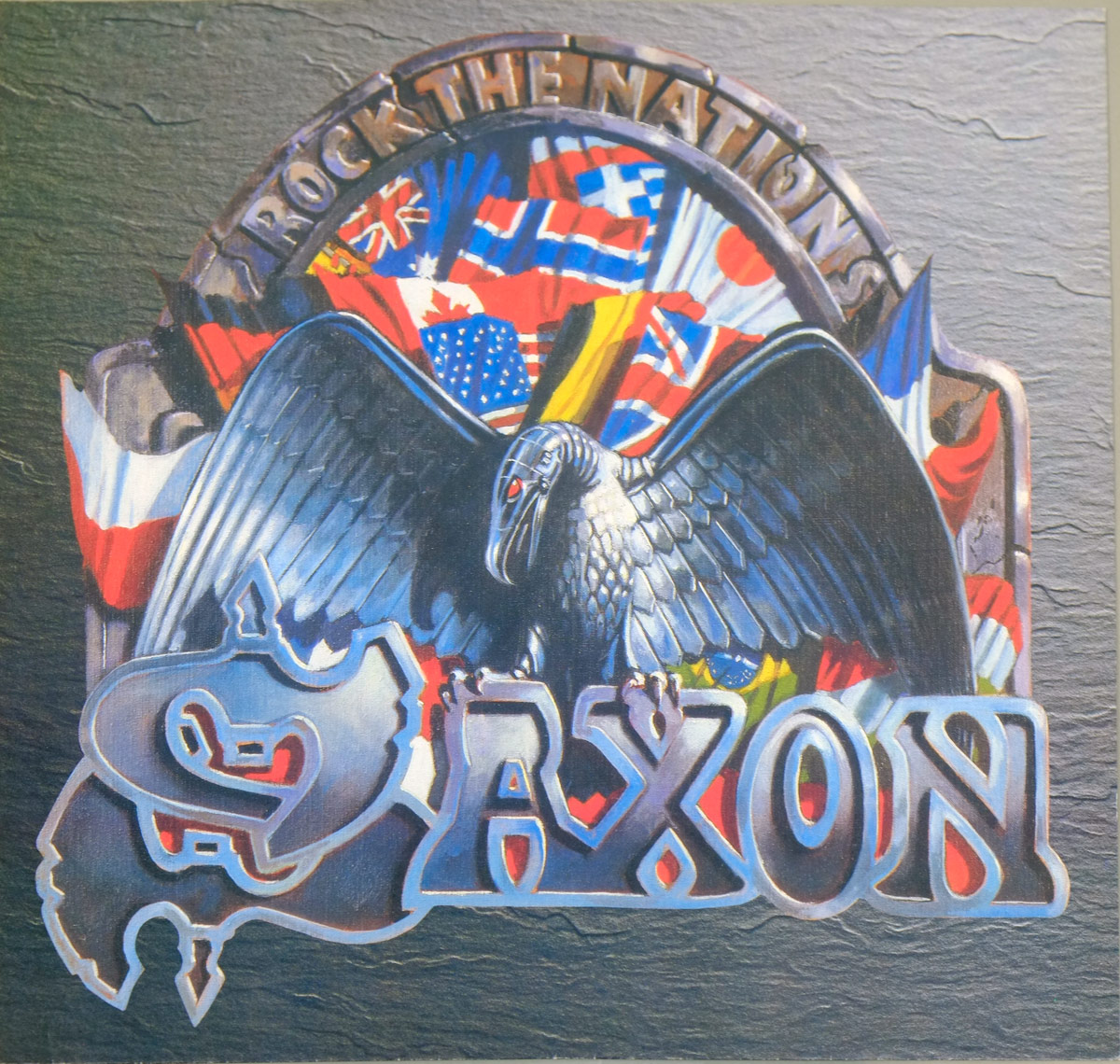 SAXON Rock The Nations inner sleeve artwork features a metallic eagle with spread wings perched on the SAXON logo, backed by a fan-shaped array of colorful national flags under an arch labeled 'Rock The Nations'—a bold tribute to global unity through heavy metal.