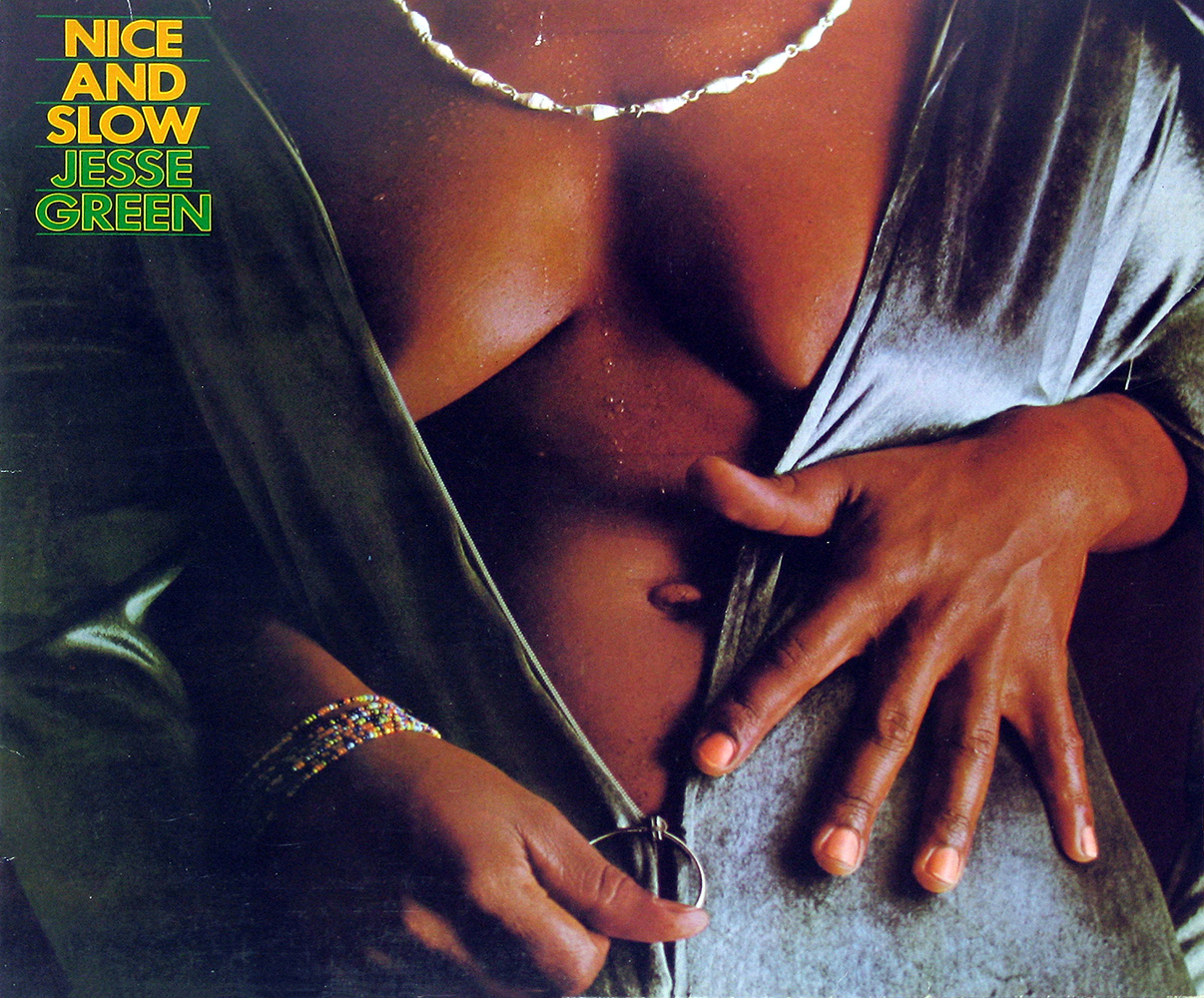 Front cover of Jesse Green's album Nice and Slow, featuring a close-up of a woman's torso draped in soft, shimmering fabric, with her hand pulling the fabric aside. She wears colorful beaded bracelets and a delicate necklace, creating a sensual and elegant visual.