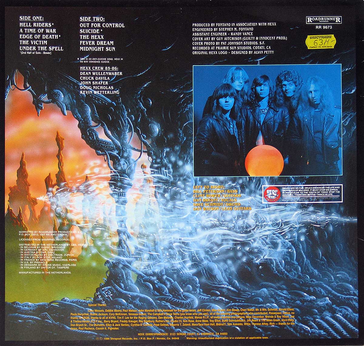 Back cover of HEXX - Under the Spell, featuring a surreal fantasy landscape with fiery cliffs, eerie mist, and a band photo with members dressed in leather jackets against a glowing orb.