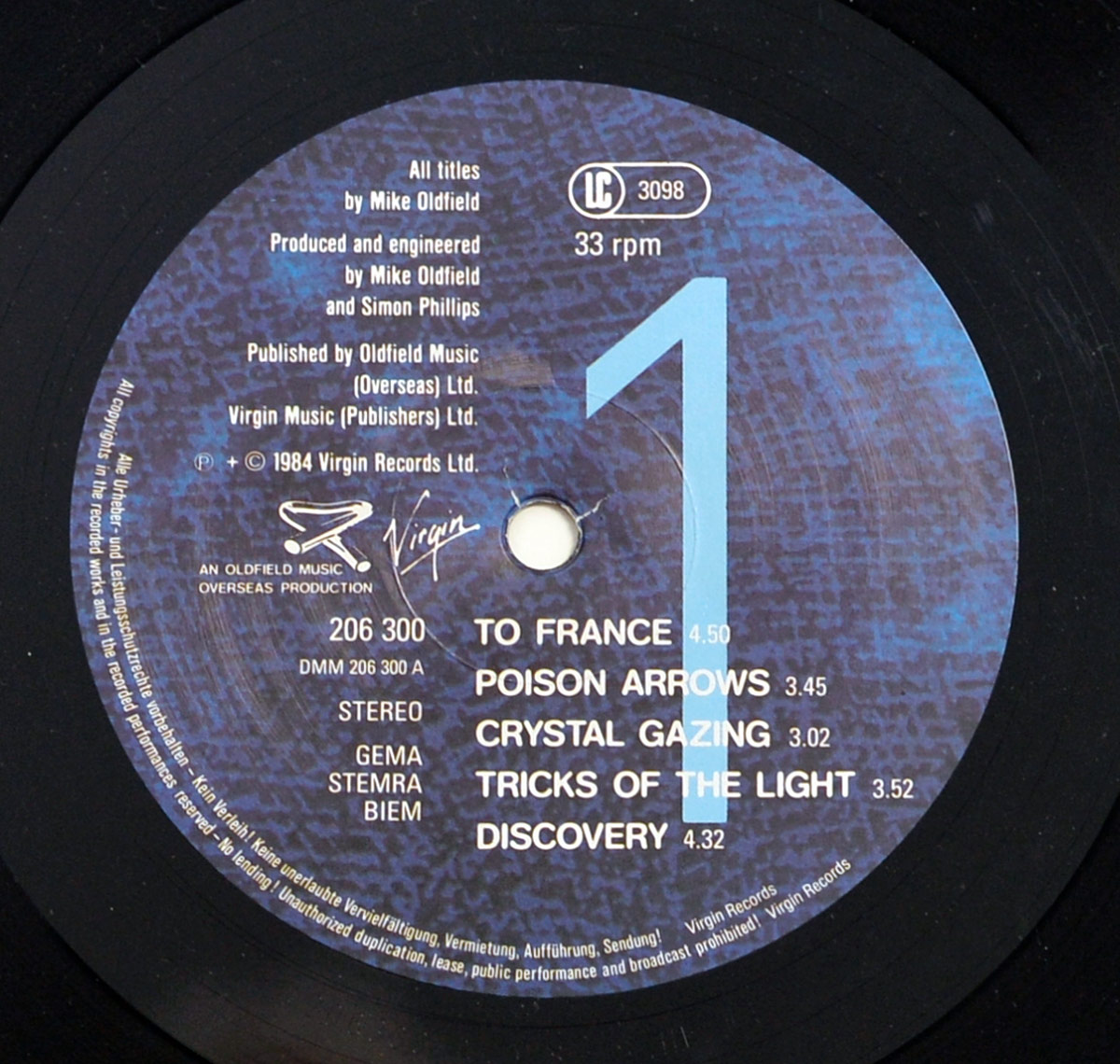 MIKE OLDFIELD Discovery vinyl Side One label with Virgin Records logo, blue textured design, large number 1, and tracklist featuring To France and Discovery.