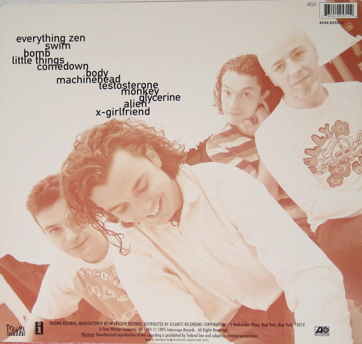 BUSH - Sixteen Stone album back cover: A sepia-toned photograph of the four band members in a relaxed pose, smiling and leaning toward the camera. The tracklist is arranged diagonally in black, bold font on the upper left side, while record label logos, copyright details, and a barcode appear in the upper right and lower corners.