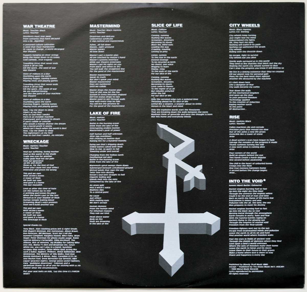 The second photo of the custom inner sleeve of 'Wreckage in Flesh' by Dr. Know features a black background with white text displaying the full album lyrics. Divided into columns, each song's title is in bold uppercase letters, followed by lyrics in a smaller font. At the bottom right, a large three-dimensional inverted cross with beveled edges is prominently featured, giving the layout a dark and heavy aesthetic. The bottom section contains special thanks and additional production notes. Visit https://vinyl-records.nl
