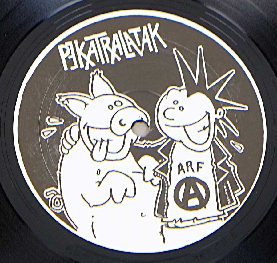 Close up of Side One record's label PEKATRALATAK - Mort Au PunK & URBAN BLIGHT - Revolte 12" LP Vinyl Album