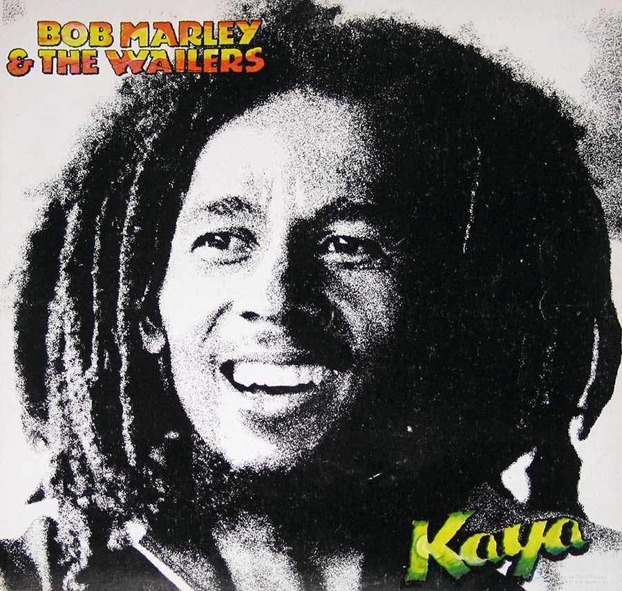 Front cover of Bob Marley & The Wailers' Kaya album, featuring a high-contrast black-and-white portrait of Bob Marley with a joyful expression, framed by his iconic dreadlocks. The title 'Kaya' is displayed in green and yellow in the bottom right corner, while 'Bob Marley & The Wailers' is written in red and yellow at the top left. https://vinyl-records.nl