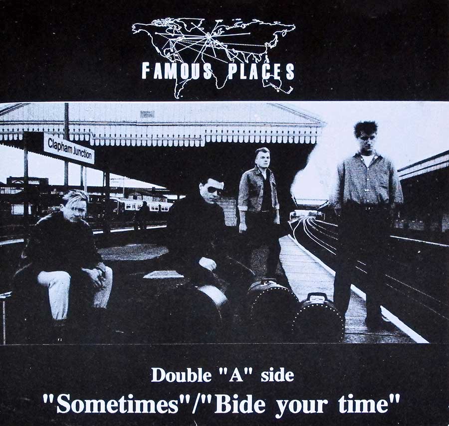 ‘Album cover for Famous Places featuring a black-and-white photo of the band at Clapham Junction train station, with instrument cases beside them. The artwork includes a world map with connecting lines above the band name and highlights the double “A” side tracks: “Sometimes” and “Bide Your Time.”’ https://vinyl-records.nl