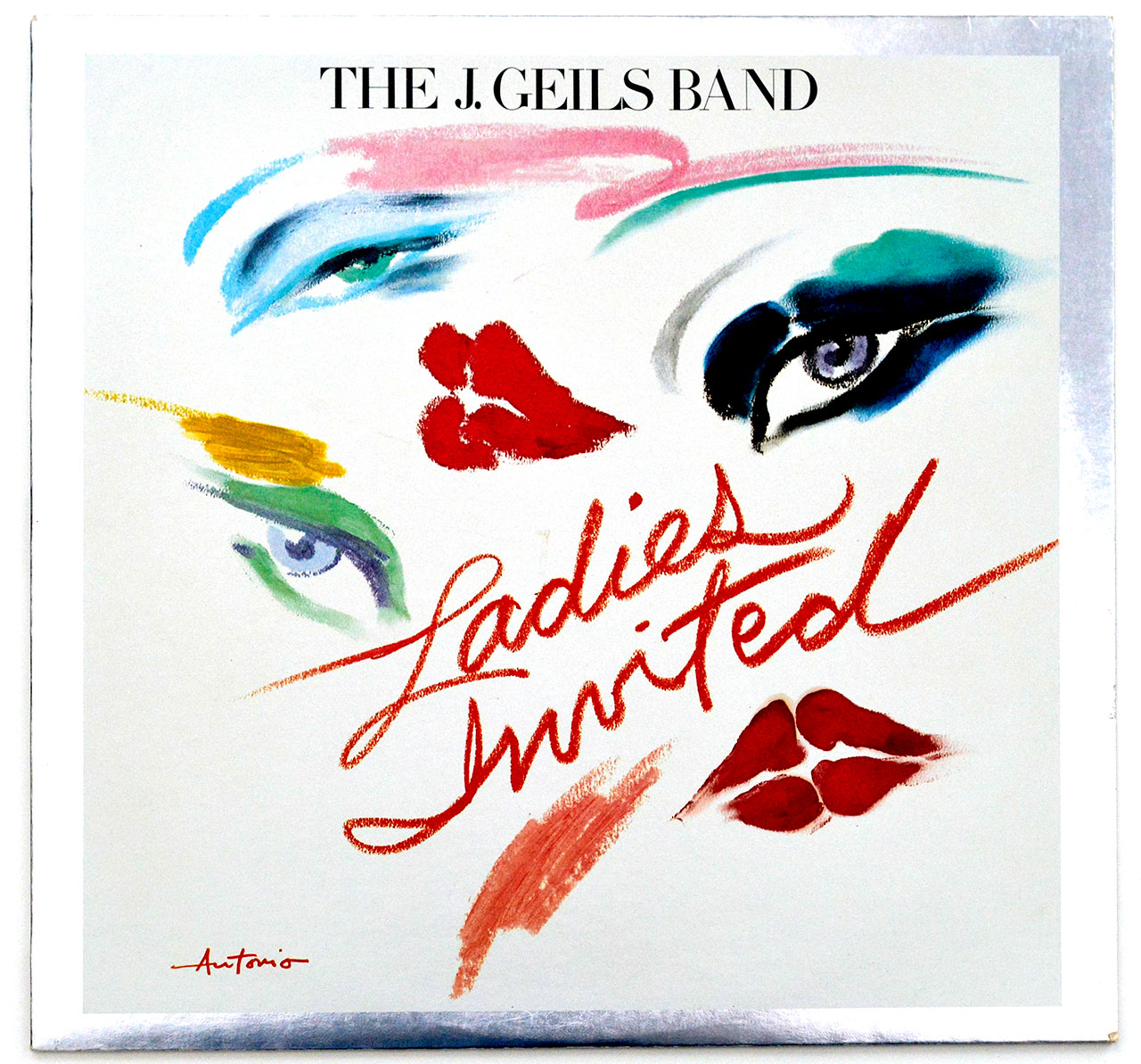 Front cover of THE J. GEILS BAND – Ladies Invited featuring Antonio's vibrant illustration of stylized eyes, lips, and bold lipstick strokes on a white background