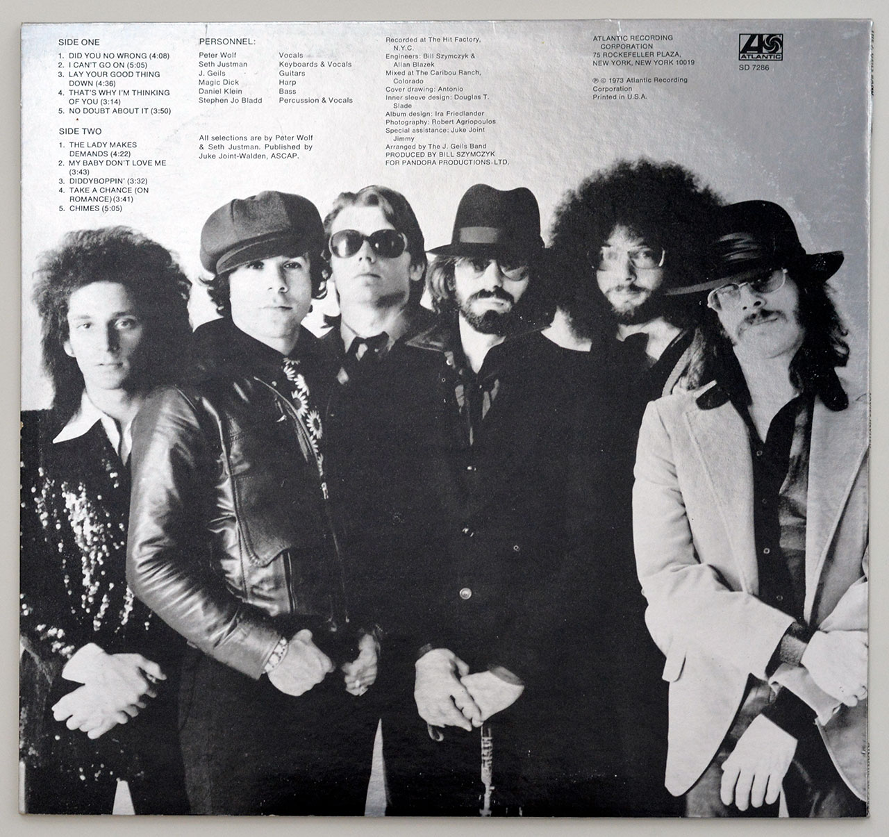 Back cover of THE J. GEILS BAND – Ladies Invited showing a black-and-white photo of the band and full track listing with credits and production details