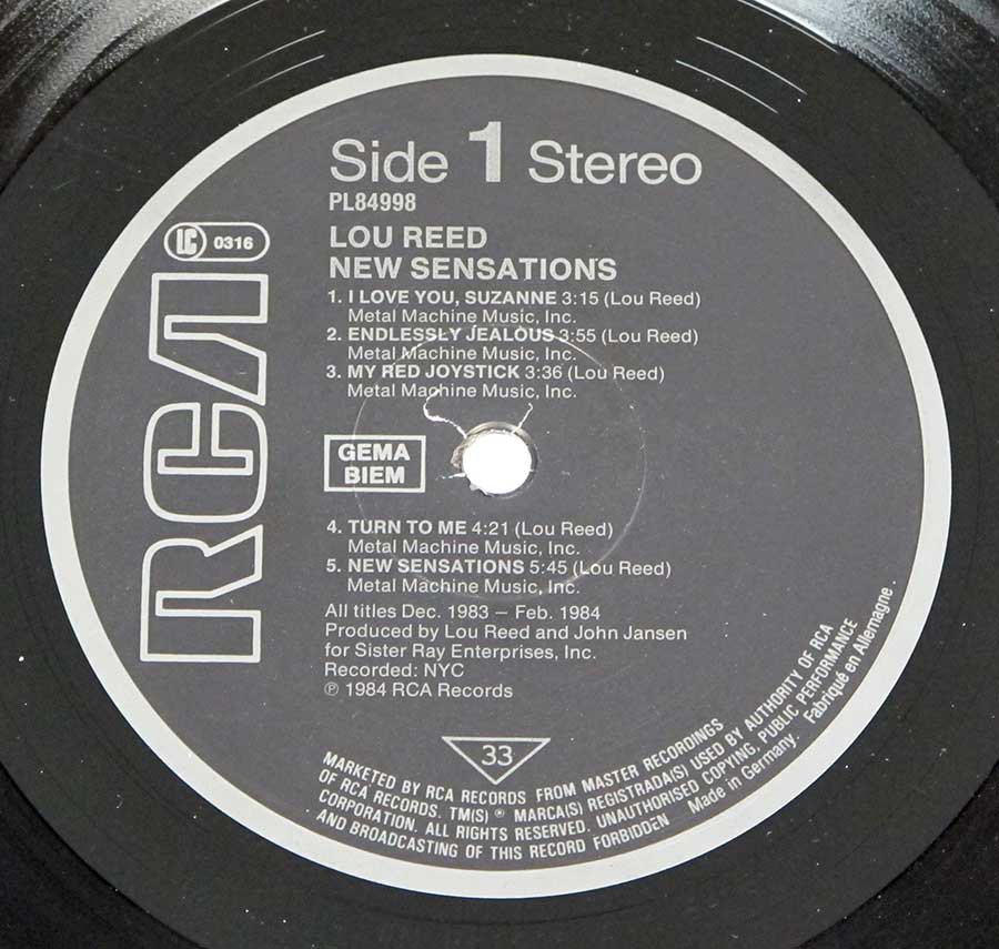 Close up of record's label LOU REED - New Sensations 12" Vinyl LP Album Side One