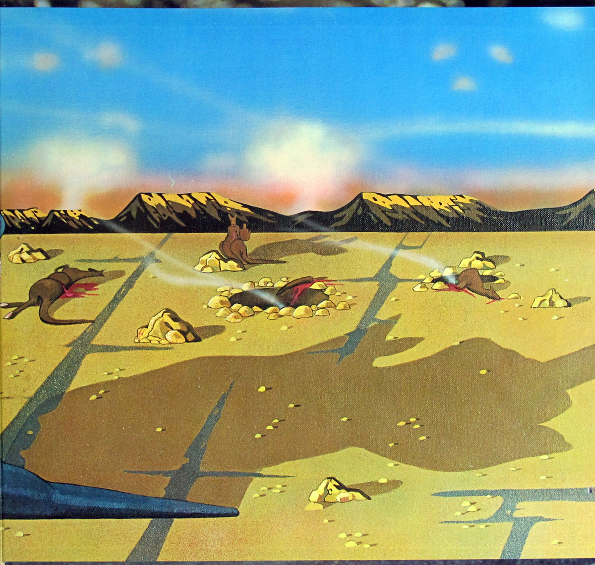 Right inside gatefold cover of Peter Kaukonen's 'Black Kangaroo' album, featuring a surreal desert landscape with dead and wounded kangaroos scattered across the barren ground. Smoke rises from a crater in the center, and distant mountains frame the horizon. The sky transitions from deep blue to a hazy orange, creating an ominous atmosphere. The dark shadow of a looming figure stretches across the ground, suggesting unseen menace. The stark and unsettling imagery aligns with the album’s raw and unconventional artistic direction.