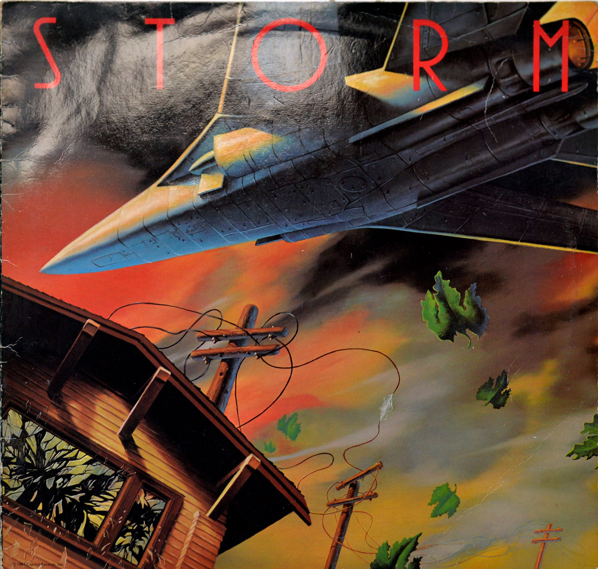 Front cover of STORM's self-titled album features a surreal, painted scene with a stealth-like jet soaring through a stormy sky over a tilted wooden house with shattered windows. Flying leaves and broken power lines suggest violent turbulence. The album title STORM is written in sharp red letters across the top