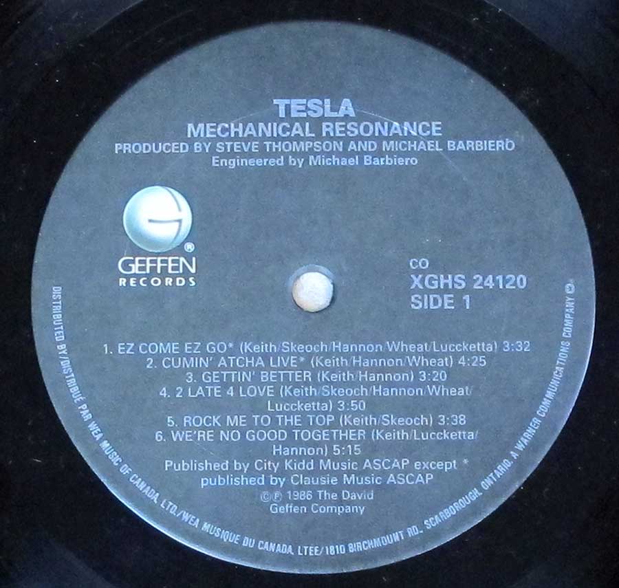 Close up of record's label TESLA - Mechanical Resonance Side One