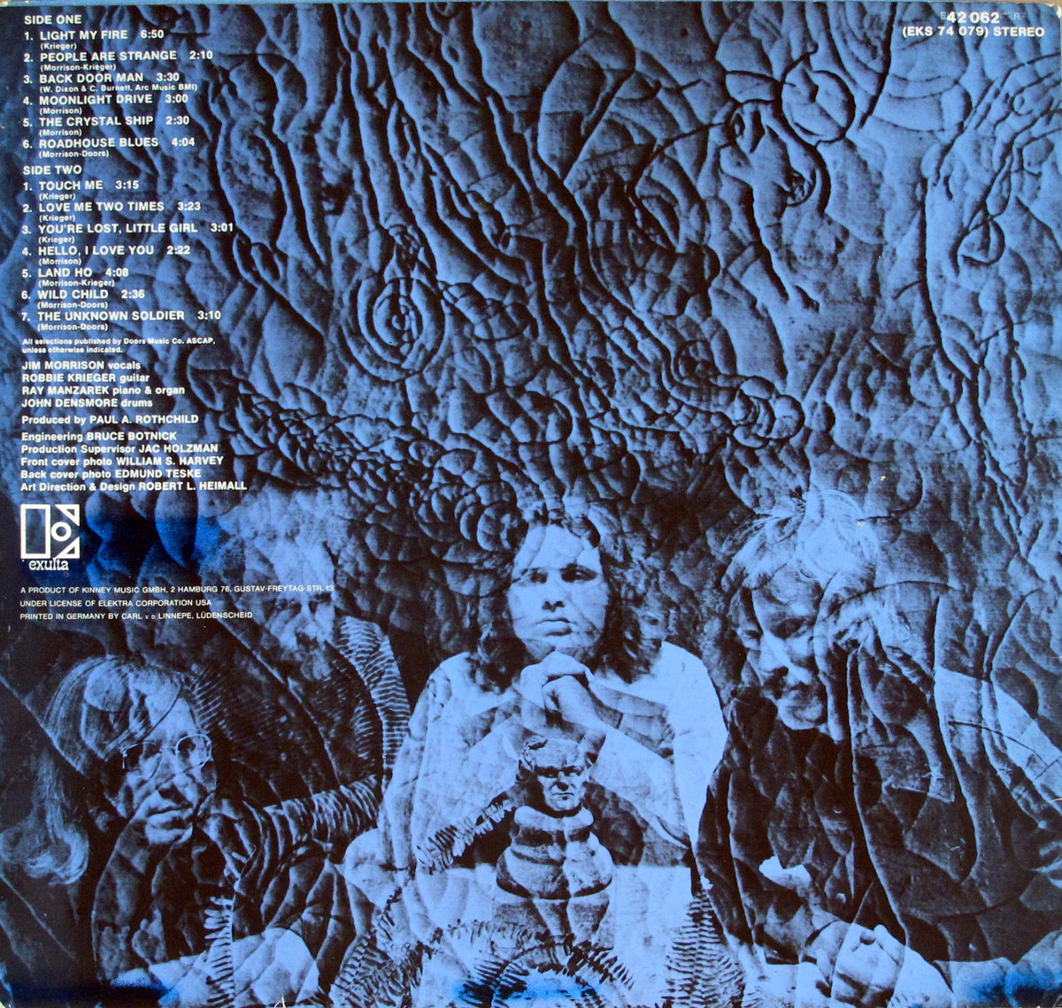 Back cover of The Doors 13 album showing a moody sepia-toned group photo of all band members standing together, dressed in casual late 1960s attire, with a song list aligned on the left side.