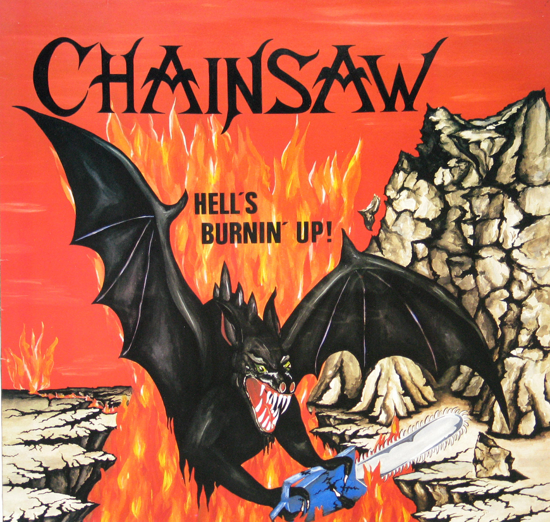 Album cover for Chainsaw’s “Hell’s Burnin’ Up!” featuring a black bat-like creature with green eyes and sharp fangs holding a blue chainsaw, surrounded by flames and cracked rocky terrain under a red sky.