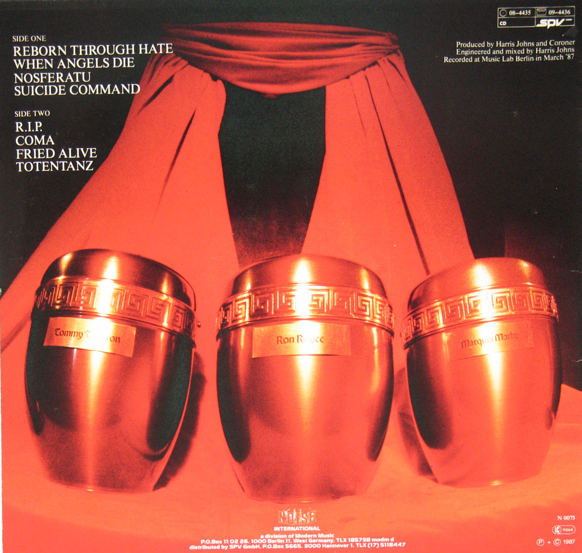 The back cover of Coroner's R.I.P. album is steeped in dark symbolism, aligning perfectly with the album's intense, thrash metal themes. The design centers around three bronze-colored urns, each engraved with the names Tommy T. Baron, Ron Royce, and Marquis Marky, referring to the members of the band. These urns are set against a deep red draped backdrop, creating a theatrical, almost ritualistic atmosphere that suggests themes of death and remembrance